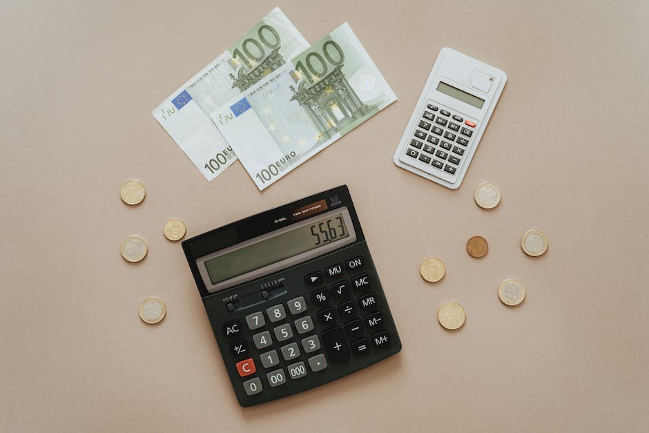 A picture of a calculator and coins with dollar signs on them representing tax implications of a SEP IRA.