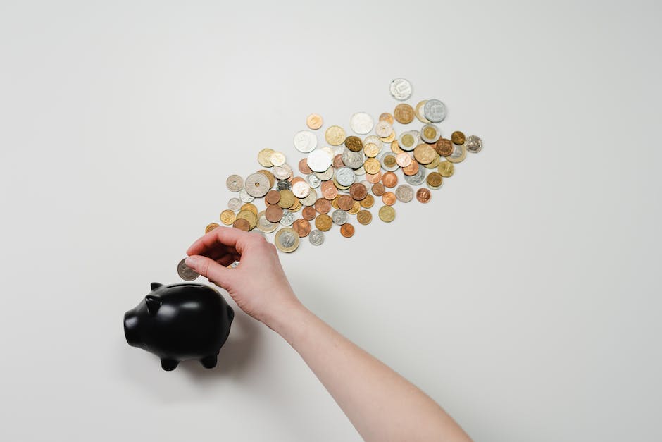 An image that shows a person putting money in a piggybank with the text 'retirement savings' written over it.