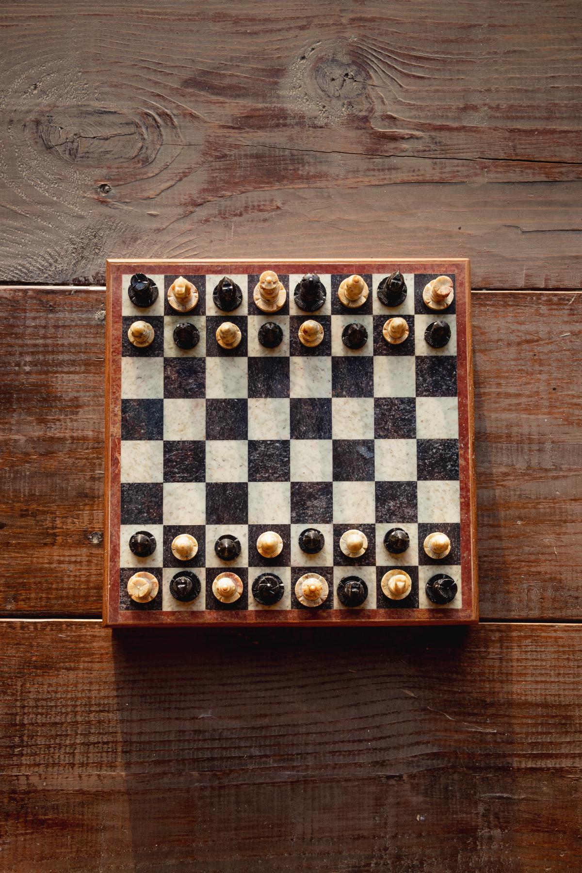 An image illustrating a chessboard with chess pieces on it, symbolizing navigating through complex tax law changes in estate planning.